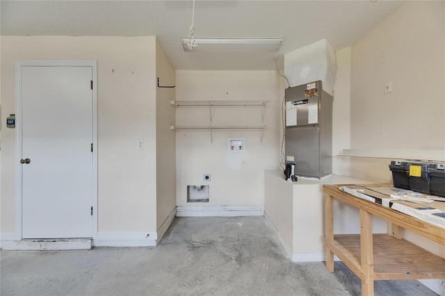 318 Lookout Dr, Apollo Beach, FL 33572 - garage with baseboards and heating unit