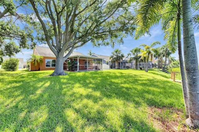 318 Lookout Dr, Apollo Beach, FL 33572 - view of green lawn with a sunroom