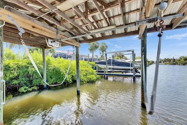 318 Lookout Dr, Apollo Beach, FL 33572 - dock featuring boat lift and a water view