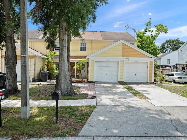 6114 Oak Cluster Cir, Tampa, FL 33634 - view of front of property featuring driveway and an attached garage