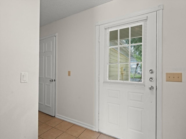 6114 Oak Cluster Cir, Tampa, FL 33634 - entryway with light tile patterned floors and baseboards