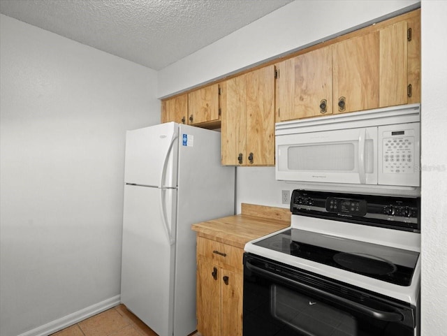 6114 Oak Cluster Cir, Tampa, FL 33634 - kitchen featuring white appliances, light countertops, a textured ceiling, and light tile patterned floors
