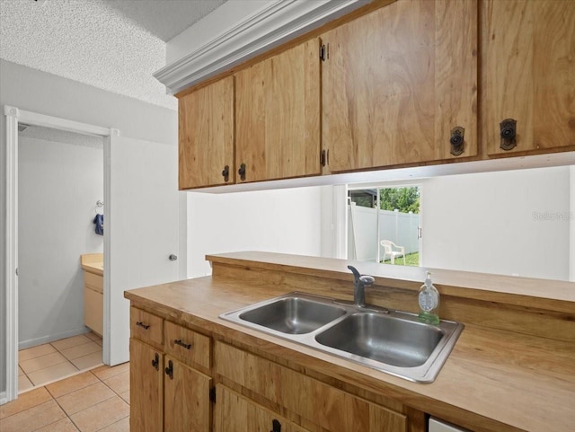 6114 Oak Cluster Cir, Tampa, FL 33634 - kitchen with light tile patterned floors, light countertops, and a textured ceiling