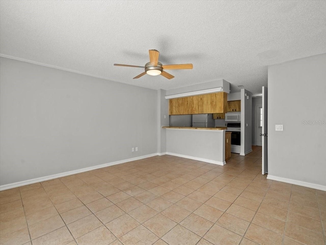 6114 Oak Cluster Cir, Tampa, FL 33634 - unfurnished living room featuring ceiling fan, a textured ceiling, and light tile patterned floors
