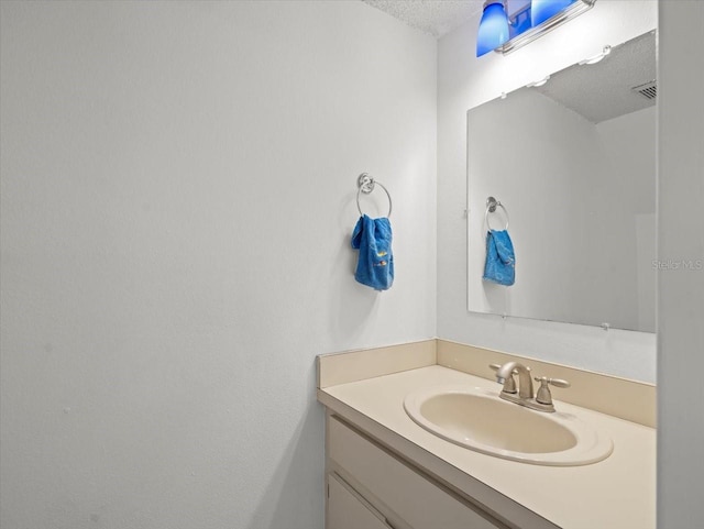 6114 Oak Cluster Cir, Tampa, FL 33634 - bathroom with vanity and a textured ceiling