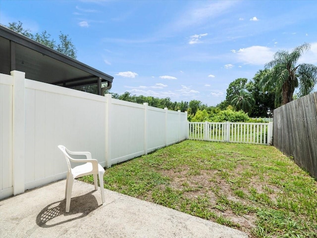 6114 Oak Cluster Cir, Tampa, FL 33634 - fenced backyard featuring a patio area