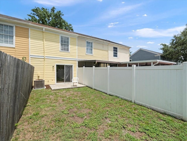 6114 Oak Cluster Cir, Tampa, FL 33634 - rear view of house with a fenced backyard and a patio area