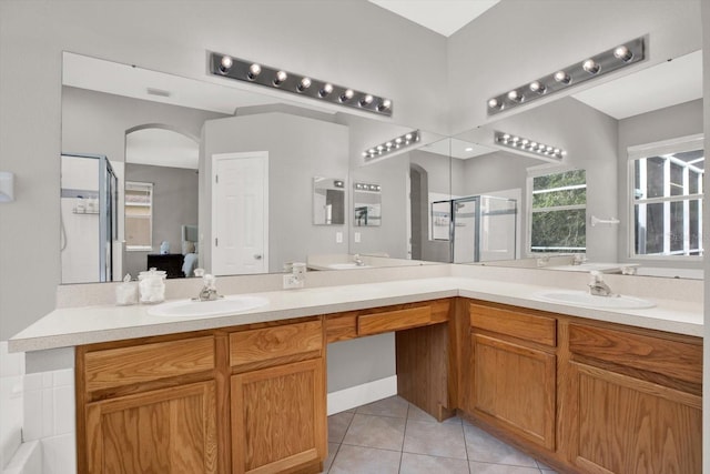 4901 Windingbrook Trl, Wesley Chapel, FL 33544 - full bathroom with a shower stall, double vanity, and tile patterned floors