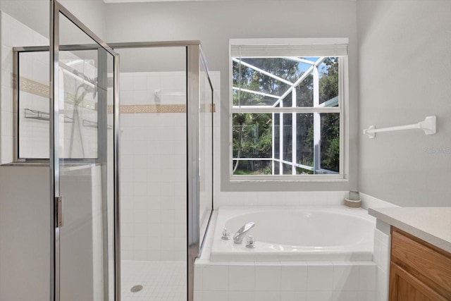 4901 Windingbrook Trl, Wesley Chapel, FL 33544 - full bathroom featuring a garden tub, vanity, and a shower stall