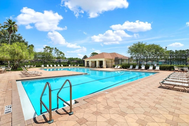 4901 Windingbrook Trl, Wesley Chapel, FL 33544 - community pool featuring a patio area