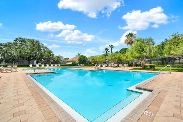 4901 Windingbrook Trl, Wesley Chapel, FL 33544 - community pool with a patio area