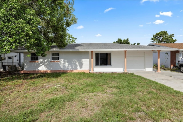 10730 Premier Ave, Port Richey, FL 34668 - ranch-style house featuring an attached garage, a front lawn, and driveway
