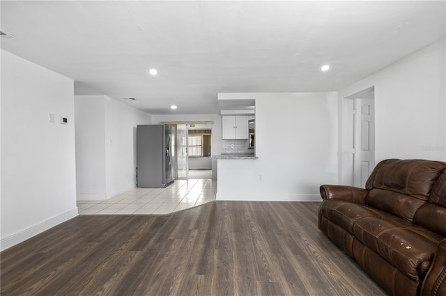 10730 Premier Ave, Port Richey, FL 34668 - living area featuring light wood-type flooring and recessed lighting