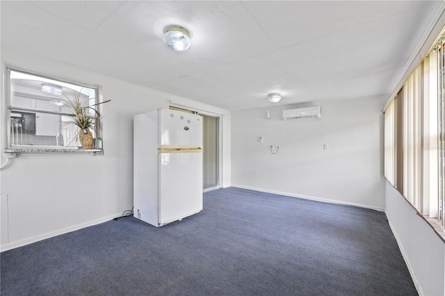 10730 Premier Ave, Port Richey, FL 34668 - spare room featuring an AC wall unit and dark colored carpet