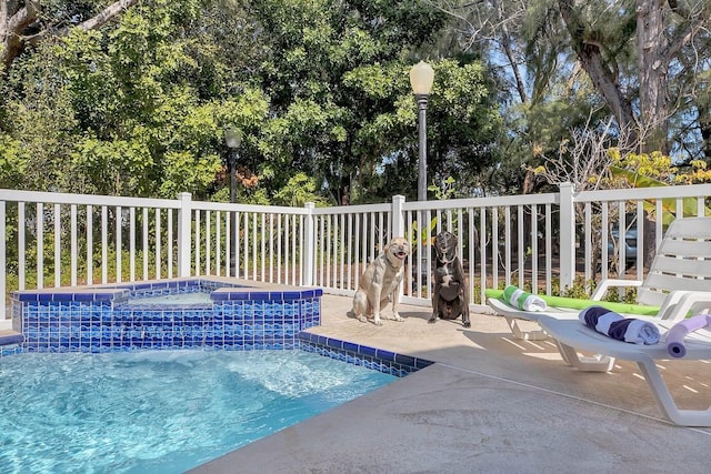 12458 1st St W, Treasure Island, FL 33706 - view of pool featuring a hot tub and a patio area