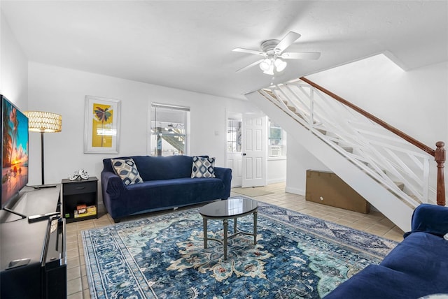 12458 1st St W, Treasure Island, FL 33706 - tiled living area featuring stairway and ceiling fan