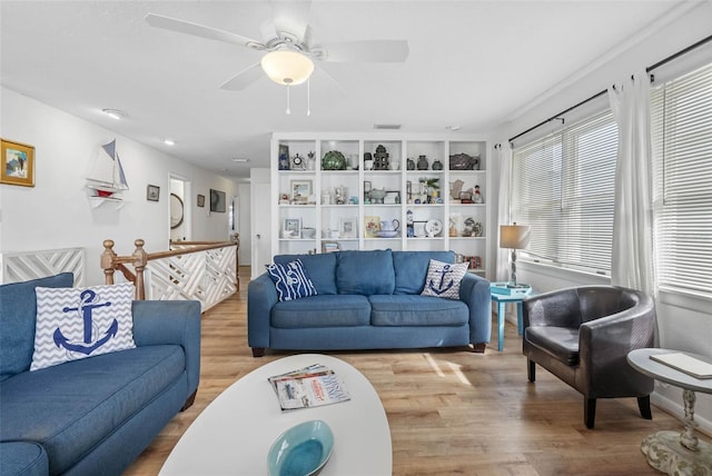 12458 1st St W, Treasure Island, FL 33706 - living area featuring wood finished floors and ceiling fan