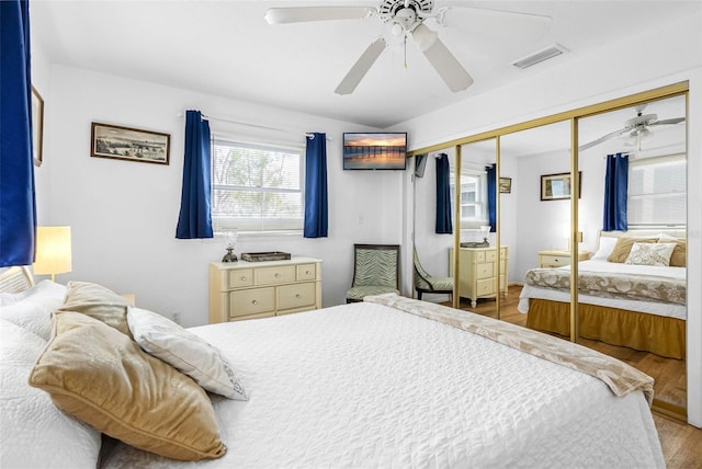 12458 1st St W, Treasure Island, FL 33706 - bedroom featuring a closet, wood finished floors, and ceiling fan