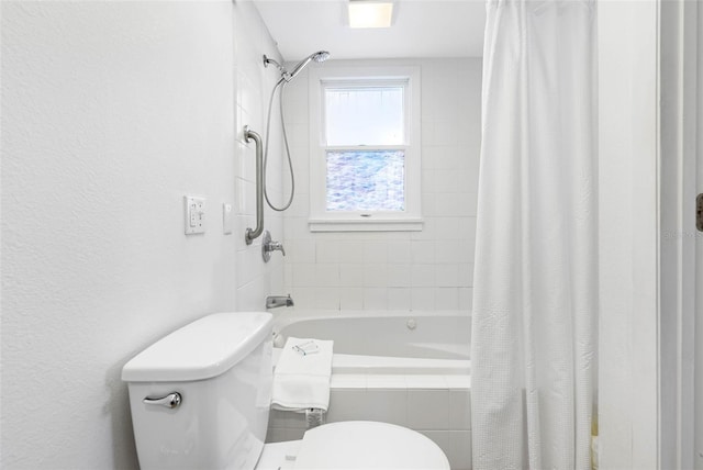12458 1st St W, Treasure Island, FL 33706 - full bathroom featuring tiled shower / bath and a textured wall