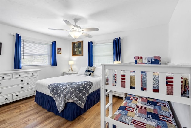 12458 1st St W, Treasure Island, FL 33706 - bedroom featuring wood finished floors and ceiling fan