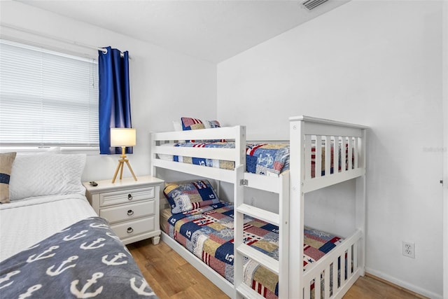 12458 1st St W, Treasure Island, FL 33706 - bedroom with wood finished floors