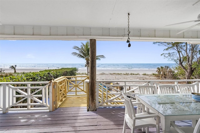 12458 1st St W, Treasure Island, FL 33706 - deck with view of water and beach and a ceiling fan