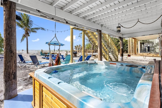 12458 1st St W, Treasure Island, FL 33706 - view of pool with a hot tub, stairway, and a swimming pool