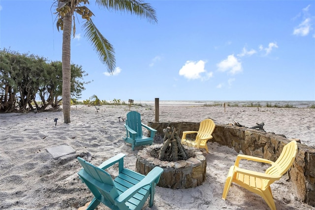 12458 1st St W, Treasure Island, FL 33706 - view of patio / terrace featuring an outdoor fire pit