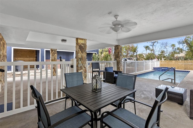 12458 1st St W, Treasure Island, FL 33706 - fenced backyard with a ceiling fan, a patio area, and outdoor dining space