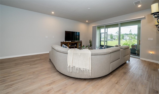 26082 Woven Wicker Bnd, Lutz, FL 33559 - living room featuring light wood-type flooring and recessed lighting
