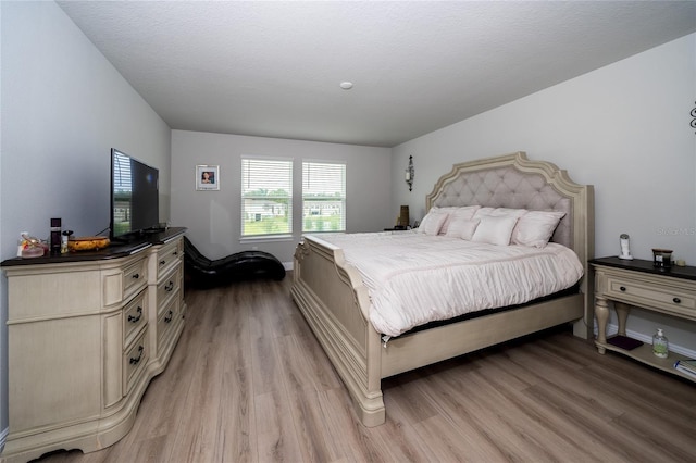 26082 Woven Wicker Bnd, Lutz, FL 33559 - bedroom with light wood-style flooring
