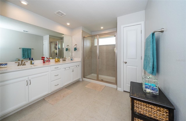 26082 Woven Wicker Bnd, Lutz, FL 33559 - full bathroom featuring double vanity, a shower stall, recessed lighting, and tile patterned flooring