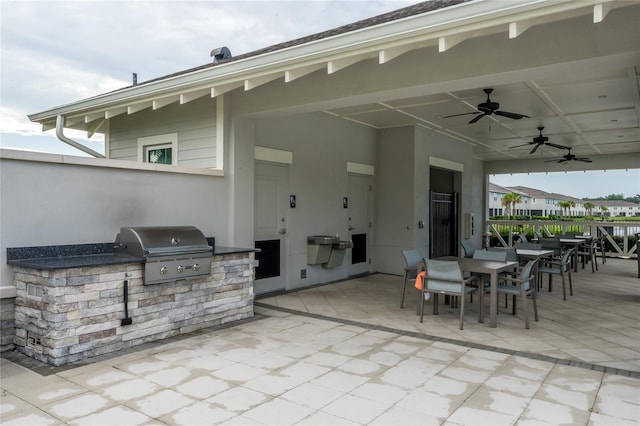 26082 Woven Wicker Bnd, Lutz, FL 33559 - view of patio with area for grilling, outdoor dining space, and a ceiling fan