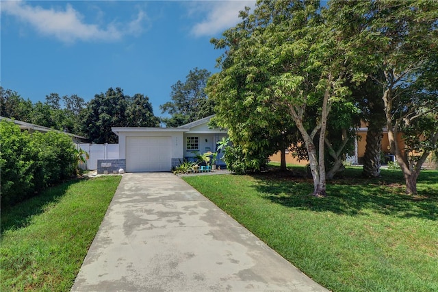 3910 14th Ave N, Saint Petersburg, FL 33713 - view of front of house featuring stucco siding, concrete driveway, and a garage