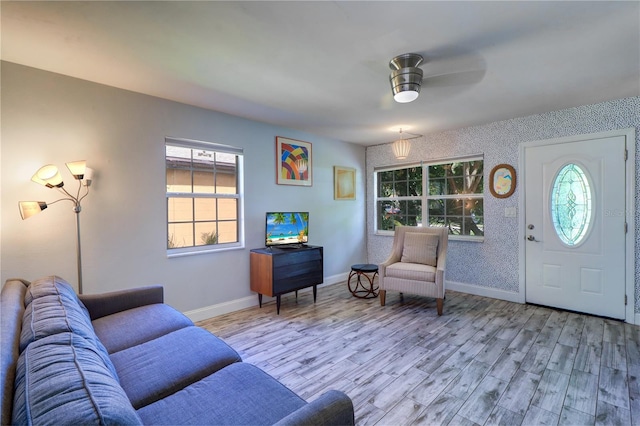 3910 14th Ave N, Saint Petersburg, FL 33713 - living area featuring wood finished floors, healthy amount of natural light, ceiling fan, and wallpapered walls