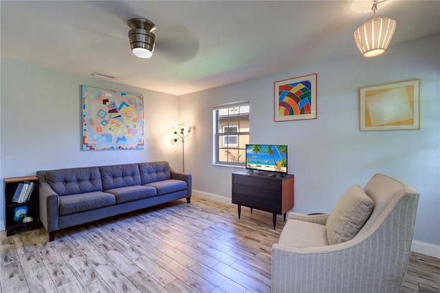 3910 14th Ave N, Saint Petersburg, FL 33713 - living room featuring wood finished floors and a ceiling fan