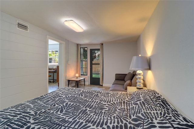 3910 14th Ave N, Saint Petersburg, FL 33713 - bedroom with access to outside and wood finished floors