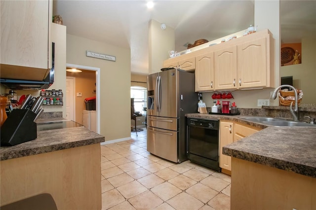 408 River Bed Ct, Wimauma, FL 33598 - kitchen with light brown cabinets, dishwasher, stainless steel fridge, washer and dryer, and dark countertops