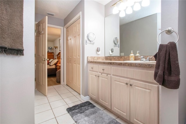 408 River Bed Ct, Wimauma, FL 33598 - bathroom featuring tile patterned floors, vanity, and connected bathroom