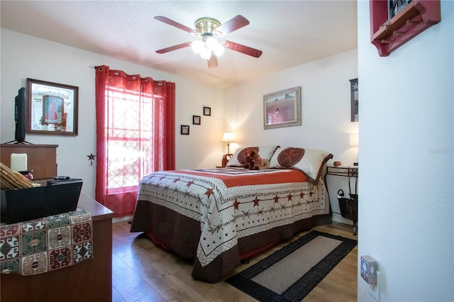 408 River Bed Ct, Wimauma, FL 33598 - bedroom featuring wood finished floors and a ceiling fan
