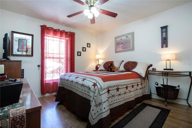 408 River Bed Ct, Wimauma, FL 33598 - bedroom with wood finished floors and ceiling fan