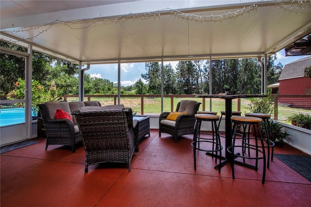 408 River Bed Ct, Wimauma, FL 33598 - sunroom featuring an outdoor hangout area