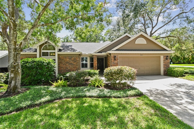 344 Cascade Ln, Palm Harbor, FL 34684 - view of front of house featuring brick siding, an attached garage, driveway, and roof with shingles