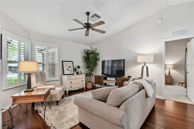344 Cascade Ln, Palm Harbor, FL 34684 - living room featuring lofted ceiling, a ceiling fan, and dark wood-style floors