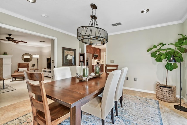 344 Cascade Ln, Palm Harbor, FL 34684 - dining area with crown molding, a chandelier, ceiling fan, and light tile patterned floors