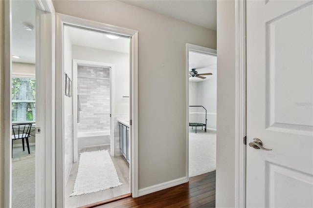 344 Cascade Ln, Palm Harbor, FL 34684 - hall featuring wood finished floors and baseboards