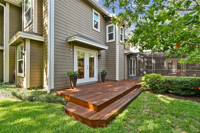344 Cascade Ln, Palm Harbor, FL 34684 - wooden deck featuring french doors and a lawn