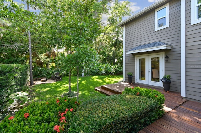344 Cascade Ln, Palm Harbor, FL 34684 - view of green lawn with a deck and french doors