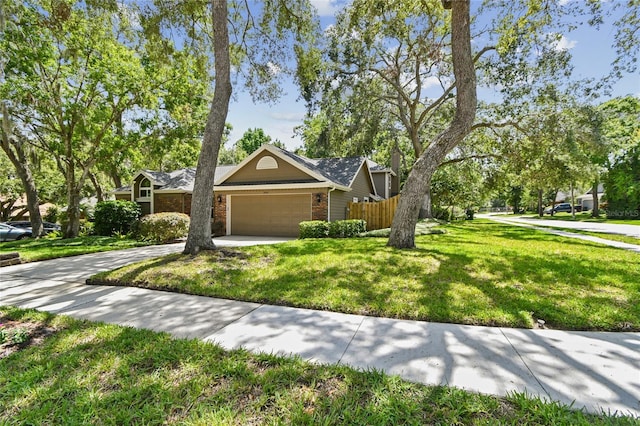 344 Cascade Ln, Palm Harbor, FL 34684 - view of front of property with a garage, brick siding, and driveway