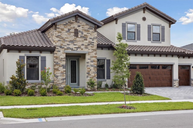 14531 Swiss Bridge Dr, Lithia, FL 33547 - mediterranean / spanish-style house featuring stucco siding, a tiled roof, stone siding, and a front lawn